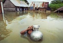 Woman in flood - Photo credit: Panos images, all rights reserved