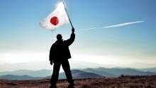 Man with a Japanese flag - Image credit: shutterstock